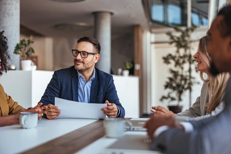 Professional sales team collaborating in modern office